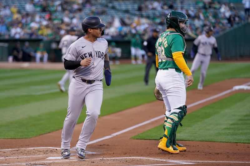 Sep 21, 2024; Oakland, California, USA; New York Yankees outfielder Juan Soto (22) scores a run against the Oakland Athletics in the first inning at the Oakland-Alameda County Coliseum. Mandatory Credit: Cary Edmondson-Imagn Images