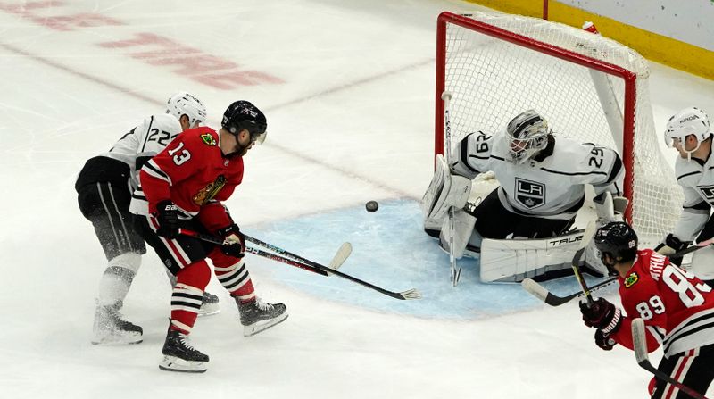 Jan 22, 2023; Chicago, Illinois, USA; Chicago Blackhawks center Max Domi (13) shoots the puck on Los Angeles Kings goaltender Pheonix Copley (29) during the second period at United Center. Mandatory Credit: David Banks-USA TODAY Sports