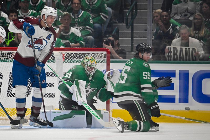 May 7, 2024; Dallas, Texas, USA; Dallas Stars defenseman Thomas Harley (55) blocks a shot in front of goaltender Jake Oettinger (29) and Colorado Avalanche right wing Mikko Rantanen (96) during the second period in game one of the second round of the 2024 Stanley Cup Playoffs at American Airlines Center. Mandatory Credit: Jerome Miron-USA TODAY Sports