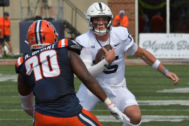 Sep 16, 2023; Champaign, Illinois, USA;  Penn State Nittany Lions quarterback Drew Allar (15) runs the ball against Illinois Fighting Illini linebacker Alex Bryant (90) during the first half at Memorial Stadium. Mandatory Credit: Ron Johnson-USA TODAY Sports