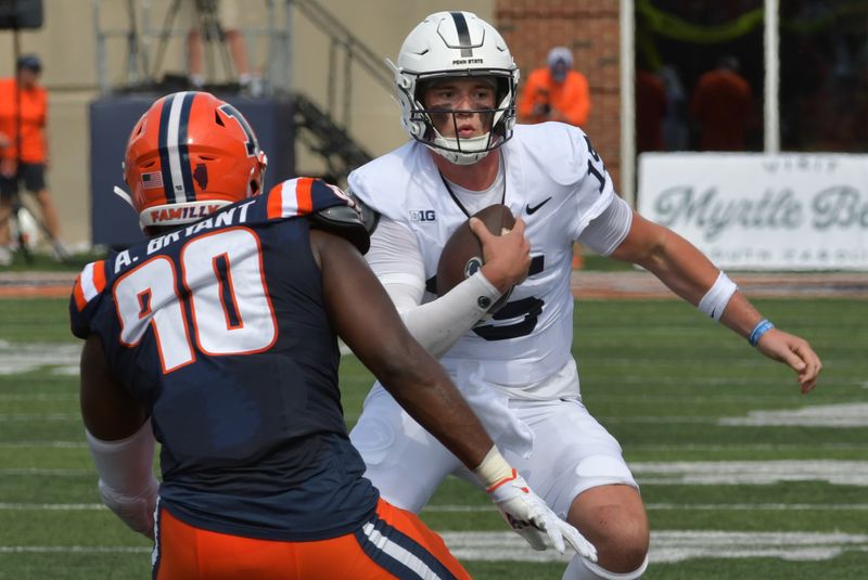 Sep 16, 2023; Champaign, Illinois, USA;  Penn State Nittany Lions quarterback Drew Allar (15) runs the ball against Illinois Fighting Illini linebacker Alex Bryant (90) during the first half at Memorial Stadium. Mandatory Credit: Ron Johnson-USA TODAY Sports