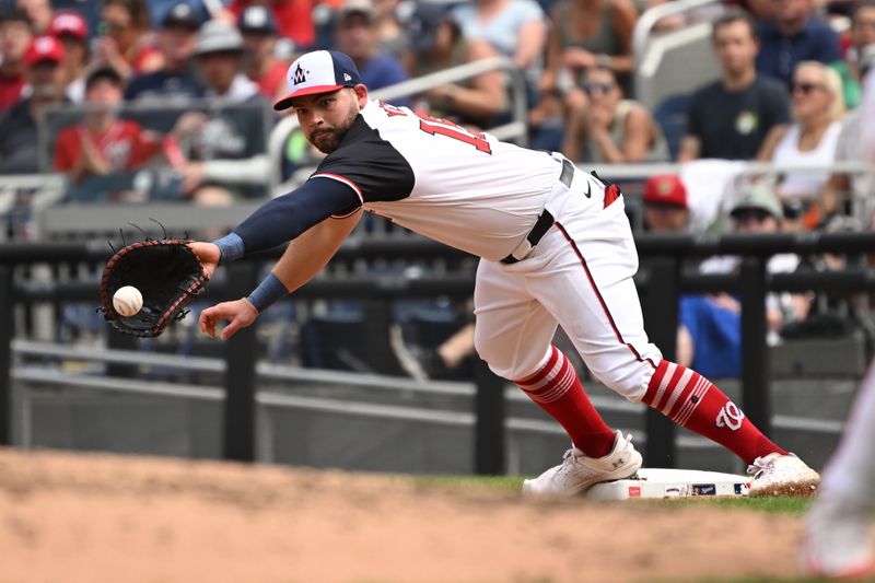 Sep 1, 2024; Washington, District of Columbia, USA; Washington Nationals first baseman Juan Yepez (18) reaches for the ball at first base against the Chicago Cubs during the fourth inning at Nationals Park. Mandatory Credit: Rafael Suanes-USA TODAY Sports