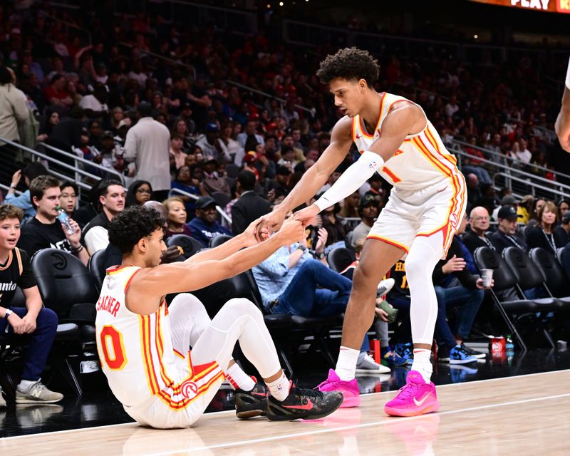 ATLANTA, GA - NOVEMBER 9: Jalen Johnson #1 helps up Zaccharie Risacher #10 of the Atlanta Hawks during the game against the Chicago Bulls on November 9, 2024 at State Farm Arena in Atlanta, Georgia.  NOTE TO USER: User expressly acknowledges and agrees that, by downloading and/or using this Photograph, user is consenting to the terms and conditions of the Getty Images License Agreement. Mandatory Copyright Notice: Copyright 2024 NBAE (Photo by Adam Hagy/NBAE via Getty Images)