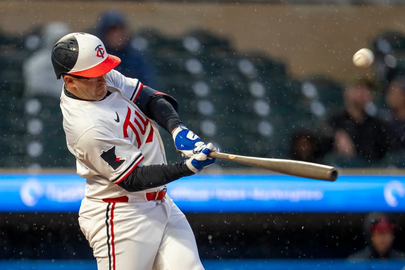 May 19, 2025; Minneapolis, Minnesota, USA; Minnesota Twins third baseman Jonah Bride (31) hits a single against the Cleveland Guardians in the first inning at Target Field. Mandatory Credit: Jesse Johnson-Imagn Images
