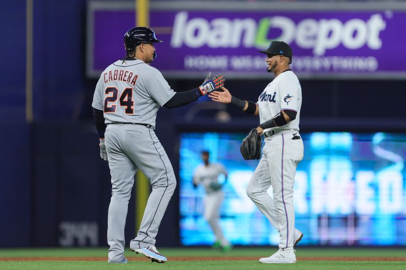 Jul 30, 2023; Miami, Florida, USA; Detroit Tigers designated hitter Miguel Cabrera (24) and Miami Marlins second baseman Luis Arraez (3) greet each other during the third inning at loanDepot Park. Mandatory Credit: Sam Navarro-USA TODAY Sports