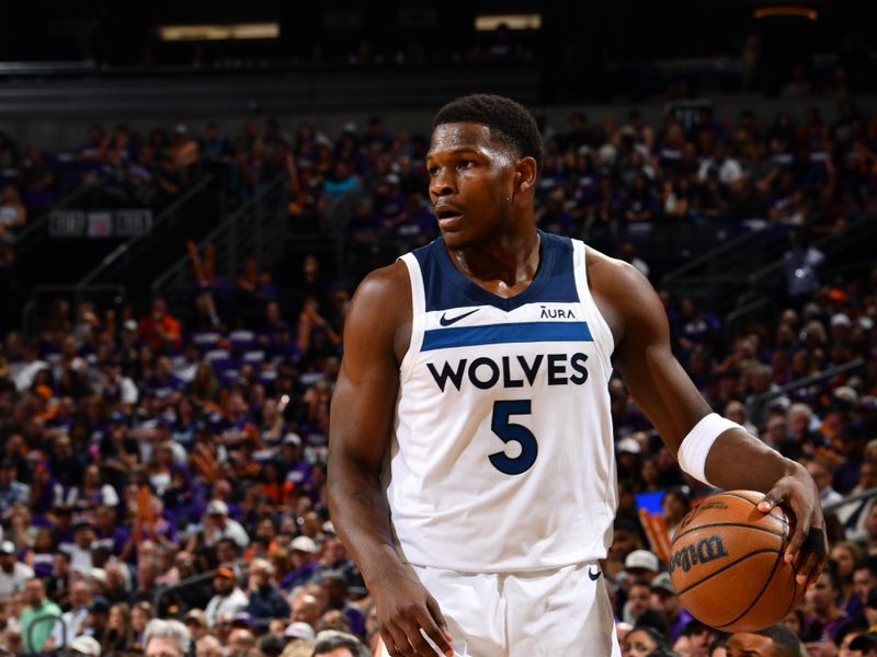 PHOENIX, AZ - APRIL 4: Anthony Edwards #5 of the Minnesota Timberwolves handles the ball during the game against the Phoenix Suns during Round 1 Game 4 of the 2024 NBA Playoffs on April 4, 2023 at Footprint Center in Phoenix, Arizona. NOTE TO USER: User expressly acknowledges and agrees that, by downloading and or using this photograph, user is consenting to the terms and conditions of the Getty Images License Agreement. Mandatory Copyright Notice: Copyright 2024 NBAE (Photo by Barry Gossage/NBAE via Getty Images)