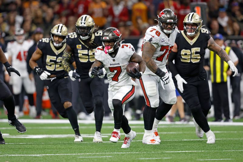 Tampa Bay Buccaneers running back Bucky Irving (7) runs the ball during an NFL football game against the New Orleans Saints, Sunday, Oct. 13, 2024, in New Orleans. (AP Photo/Tyler Kaufman)