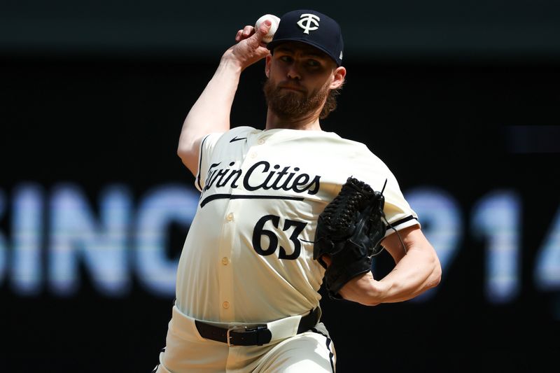 May 9, 2024; Minneapolis, Minnesota, USA; Minnesota Twins relief pitcher Josh Staumont (63) delivers a pitch against the Seattle Mariners during the ninth inning at Target Field. Mandatory Credit: Matt Krohn-USA TODAY Sports