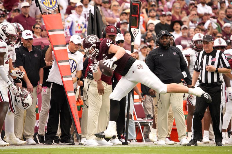 Oct 28, 2023; College Station, Texas, USA; Texas A&M Aggies tight end Max Wright (42) catches a pass before running out of bounds during the second half in a game against South Carolina Gamecocks at Kyle Field. Mandatory Credit: Dustin Safranek-USA TODAY Sports