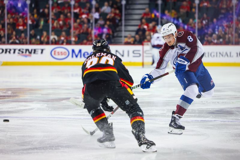 Mar 12, 2024; Calgary, Alberta, CAN; Colorado Avalanche defenseman Cale Makar (8) shoots the puck against the Calgary Flames during the first period at Scotiabank Saddledome. Mandatory Credit: Sergei Belski-USA TODAY Sports