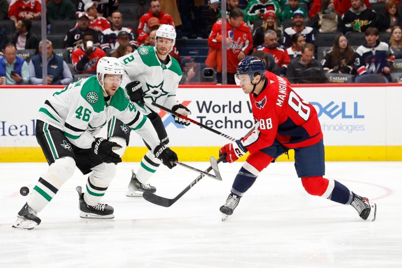 Oct 17, 2024; Washington, District of Columbia, USA; Washington Capitals left wing Andrew Mangiapane (88) shoots the puck as Dallas Stars defenseman Ilya Lyubushkin (46) defends in the first period at Capital One Arena. Mandatory Credit: Geoff Burke-Imagn Images