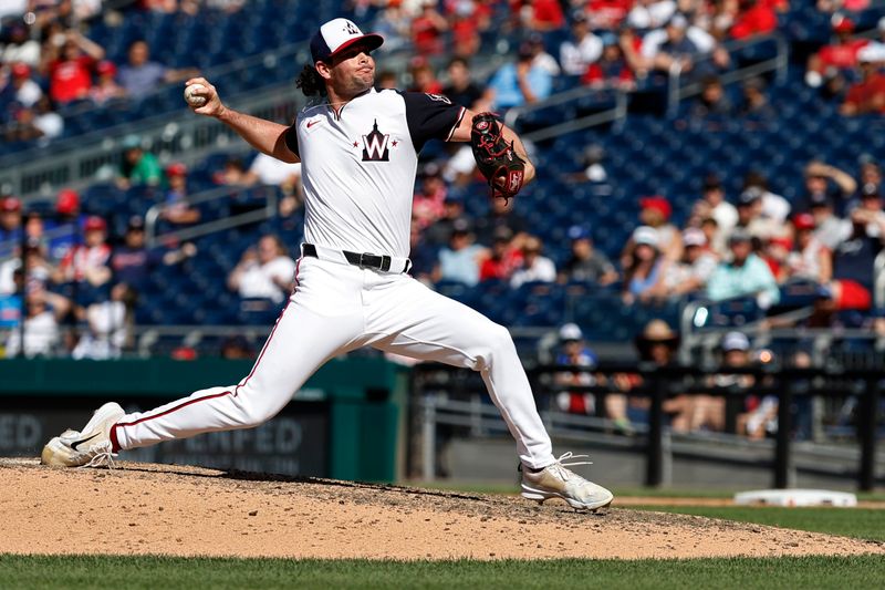 Jun 9, 2024; Washington, District of Columbia, USA; Washington Nationals relief pitcher Kyle Finnegan (67) pitches against the Atlanta Braves during the ninth inning at Nationals Park. Mandatory Credit: Geoff Burke-USA TODAY Sports