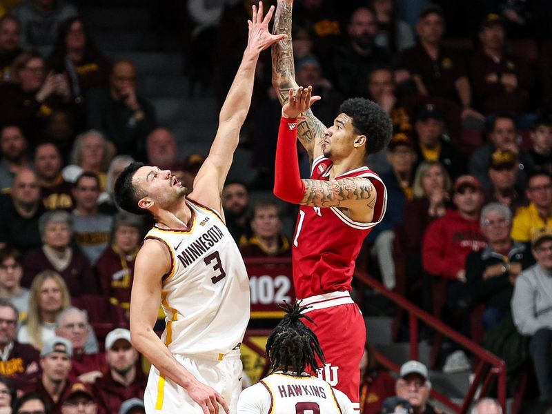 Mar 6, 2024; Minneapolis, Minnesota, USA; Indiana Hoosiers center Kel'el Ware (1) shoots as Minnesota Golden Gophers forward Dawson Garcia (3) defends during the first half at Williams Arena. Mandatory Credit: Matt Krohn-USA TODAY Sports