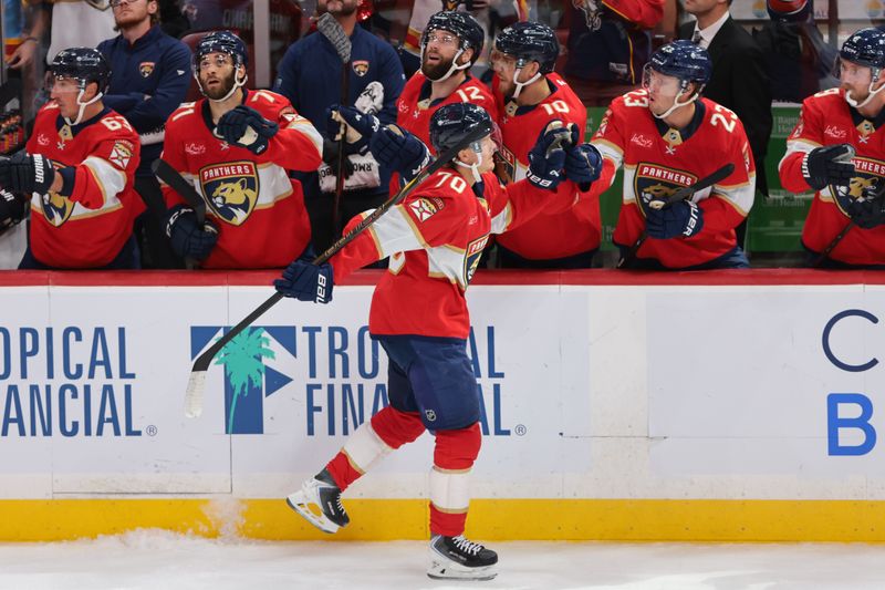 Oct 7, 2025; Sunrise, Florida, USA;  Florida Panthers center Jesper Boqvist (70) celebrates with teammates after scoring against the Chicago Blackhawks during the third period at Amerant Bank Arena. Mandatory Credit: Sam Navarro-Imagn Images