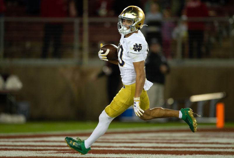 Nov 25, 2023; Stanford, California, USA; Notre Dame Fighting Irish wide receiver Jordan Faison (80) runs in his touchdown reception against the Stanford Cardinal during the third quarter at Stanford Stadium. Mandatory Credit: D. Ross Cameron-USA TODAY Sports