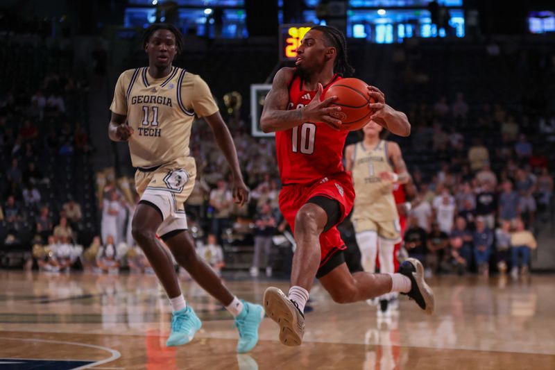 Mar 1, 2025; Atlanta, Georgia, USA; North Carolina State Wolfpack guard Marcus Hill (10) drives to the basket against the Georgia Tech Yellow Jackets in the first half at McCamish Pavilion. Mandatory Credit: Brett Davis-Imagn Images
