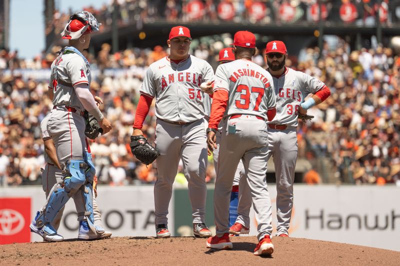 Jun 16, 2024; San Francisco, California, USA;  Los Angeles Angels manager Ron Washington (37) relieves pitcher José Suarez (54) during the fourth inning against the San Francisco Giants at Oracle Park. Mandatory Credit: Stan Szeto-USA TODAY Sports