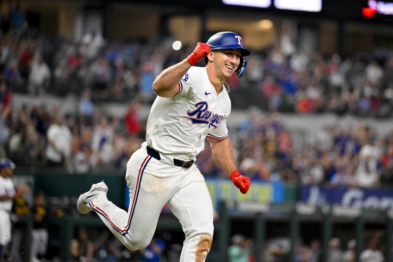 Aug 21, 2024; Arlington, Texas, USA; Texas Rangers left fielder Wyatt Langford (36) celebrates after driving in the game winning run by pinch runner Ezequiel Duran (not pictured) against the Pittsburgh Pirates during the ninth inning at Globe Life Field. Mandatory Credit: Jerome Miron-USA TODAY Sports