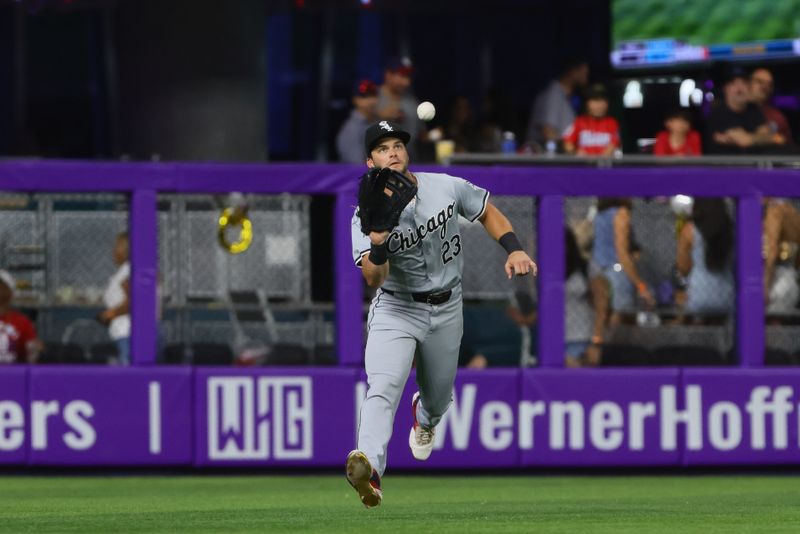 Jul 5, 2024; Miami, Florida, USA; Chicago White Sox left fielder Andrew Benintendi (23) catches a fly ball to retire Miami Marlins left fielder Bryan De La Cruz (not pictured) during the first inning at loanDepot Park. Mandatory Credit: Sam Navarro-USA TODAY Sports