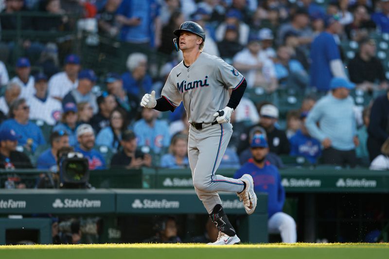 May 14, 2025; Chicago, Illinois, USA; Miami Marlins center fielder Kyle Stowers (28) rounds the bases after hitting a solo home run against the Chicago Cubs during the second inning at Wrigley Field. Mandatory Credit: Kamil Krzaczynski-Imagn Images