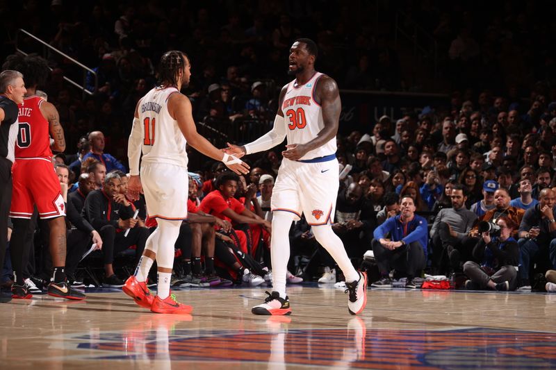 NEW YORK, NY - JANUARY 3: Julius Randle #30 high fives Jalen Brunson #11 of the New York Knicks during the game against the Chicago Bulls on January 3, 2024 at Madison Square Garden in New York City, New York.  NOTE TO USER: User expressly acknowledges and agrees that, by downloading and or using this photograph, User is consenting to the terms and conditions of the Getty Images License Agreement. Mandatory Copyright Notice: Copyright 2024 NBAE  (Photo by Nathaniel S. Butler/NBAE via Getty Images)