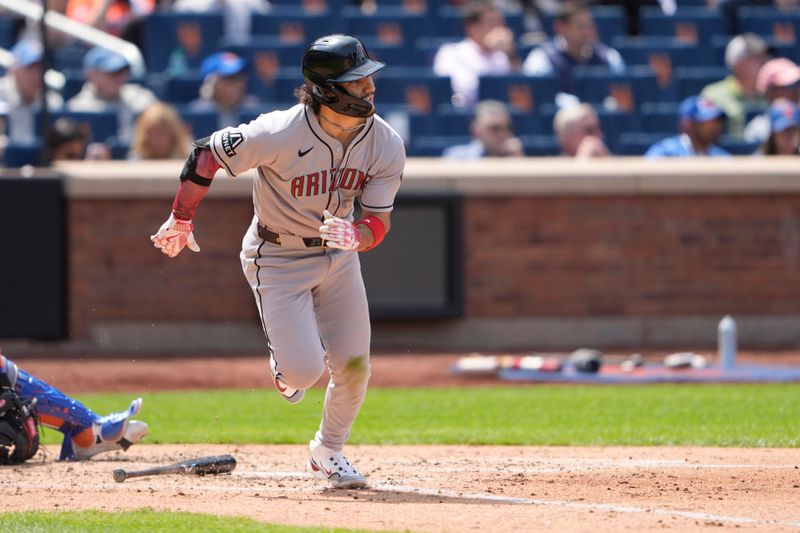 May 1, 2025; New York City, New York, USA; Arizona Diamondbacks center fielder Alek Thomas (5) hits a single scoring a run on an error during the fourth inning at Citi Field. Mandatory Credit: Gregory Fisher-Imagn Images