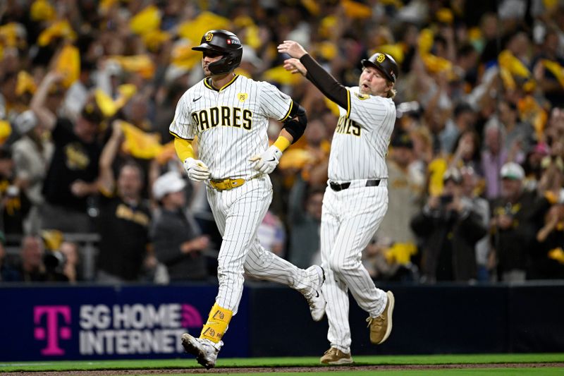 Oct 1, 2024; San Diego, California, USA; San Diego Padres catcher Kyle Higashioka (20) runs the bases after hitting a solo home run against the Atlanta Braves during the eighth inning in game one of the Wildcard round for the 2024 MLB Playoffs at Petco Park. Mandatory Credit: Denis Poroy-Imagn Images