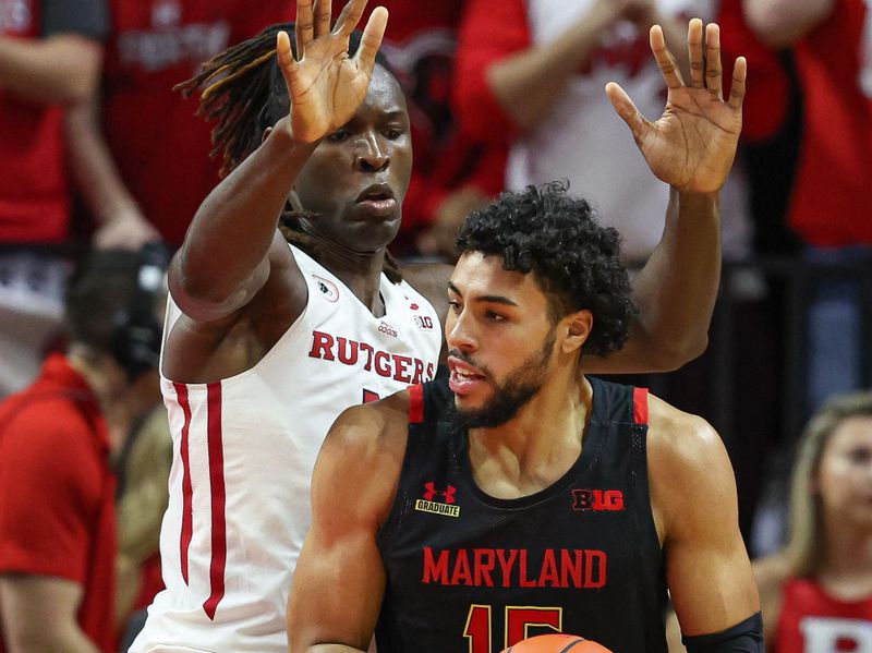 Jan 5, 2023; Piscataway, New Jersey, USA; Maryland Terrapins forward Patrick Emilien (15) looks to the basket as Rutgers Scarlet Knights center Clifford Omoruyi (11) defends during the second half at Jersey Mike's Arena. Mandatory Credit: Vincent Carchietta-USA TODAY Sports