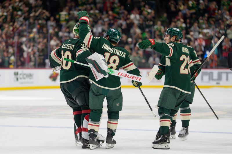 Oct 13, 2025; Saint Paul, Minnesota, USA; Minnesota Wild center Vinnie Hinostroza (18) and left wing Liam Ohgren (28) are the first to congratulate goaltender Jesper Wallstedt (30) after he secures the overtime win against the Los Angeles Kings in shootouts at Grand Casino Arena. Mandatory Credit: Matt Blewett-Imagn Images