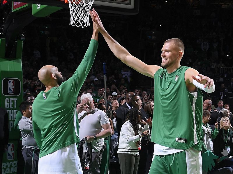 BOSTON, MA - APRIL 3: Kristaps Porzingis #8 of the Boston Celtics high fives Derrick White #9 before the game against the Oklahoma City Thunder on April 3, 2024 at the TD Garden in Boston, Massachusetts. NOTE TO USER: User expressly acknowledges and agrees that, by downloading and or using this photograph, User is consenting to the terms and conditions of the Getty Images License Agreement. Mandatory Copyright Notice: Copyright 2024 NBAE  (Photo by Brian Babineau/NBAE via Getty Images)