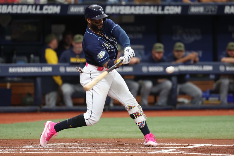 May 20, 2023; St. Petersburg, Florida, USA; Tampa Bay Rays first baseman Yandy Diaz (2) hits a 3-run home run during the second inning against the Milwaukee Brewers at Tropicana Field. Mandatory Credit: Kim Klement-USA TODAY Sports