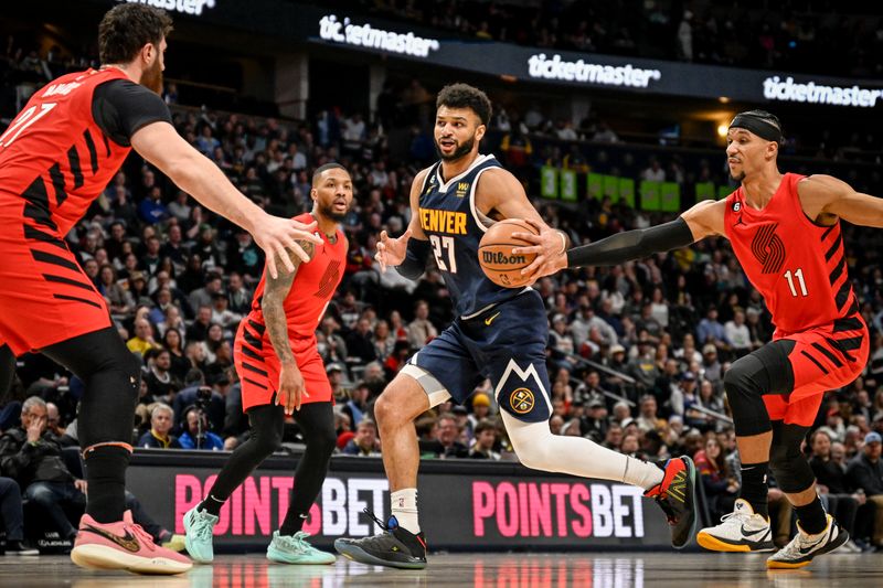 DENVER, CO - JANUARY 17: Jamal Murray (27) of the Denver Nuggets drives against Jusuf Nurkic (27) and Josh Hart (11) of the Portland Trail Blazers during the first quarter at Ball Arena in Denver on Tuesday, January 17, 2023. (Photo by AAron Ontiveroz/MediaNews Group/The Denver Post via Getty Images)