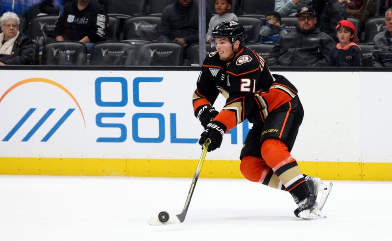 Mar 24, 2024; Anaheim, California, USA;  Anaheim Ducks center Isac Lundestrom (21) skates with the puck during the second period against the Tampa Bay Lightning  at Honda Center. Mandatory Credit: Jason Parkhurst-USA TODAY Sports