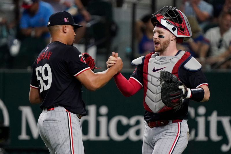 Aug 16, 2024; Arlington, Texas, USA; Minnesota Twins pitcher Jhoan Duran (59) and catcher Ryan Jeffers (27) shake hands following the game against the Texas Rangers at Globe Life Field. Mandatory Credit: Raymond Carlin III-USA TODAY Sports