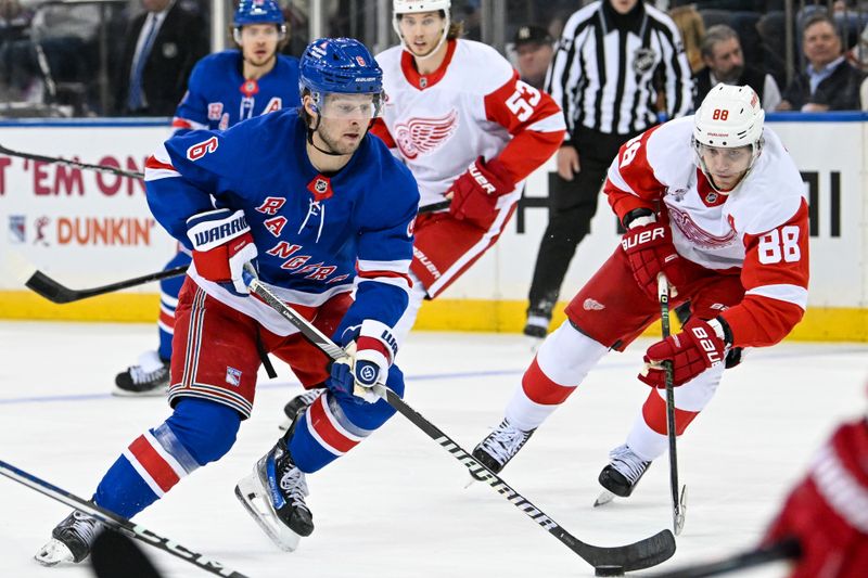 Oct 14, 2024; New York, New York, USA;  New York Rangers defenseman Zac Jones (6) skates with the puck while defended by Detroit Red Wings right wing Patrick Kane (88) during the third period at Madison Square Garden. Mandatory Credit: Dennis Schneidler-Imagn Images