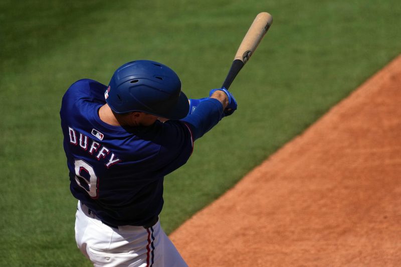 Mar 8, 2024; Surprise, Arizona, USA; Texas Rangers second baseman Matt Duffy (9) bats against the Kansas City Royals during the second inning at Surprise Stadium. Mandatory Credit: Joe Camporeale-USA TODAY Sports