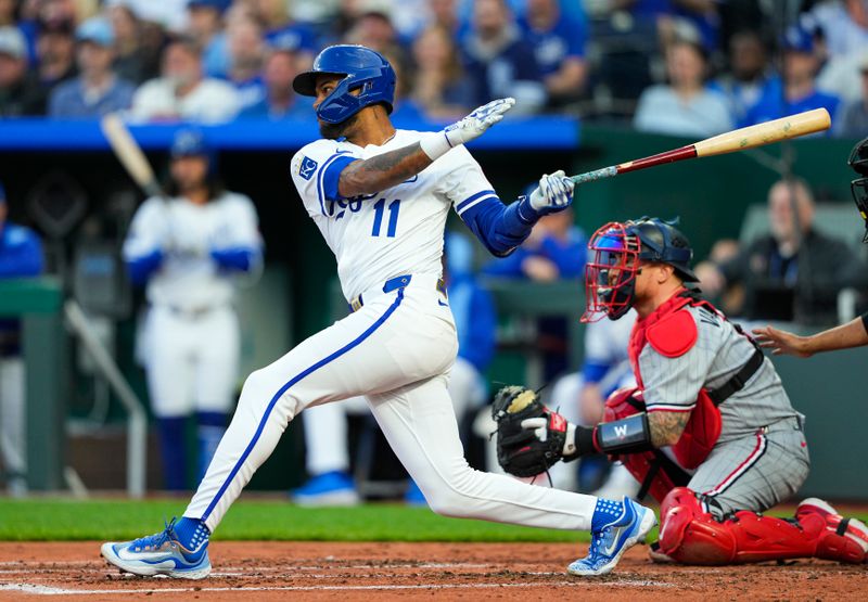 Apr 9, 2025; Kansas City, Missouri, USA; Kansas City Royals third baseman Maikel Garcia (11) hits a single during the third inning against the Minnesota Twins at Kauffman Stadium. Mandatory Credit: Jay Biggerstaff-Imagn Images