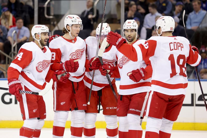 Nov 29, 2023; New York, New York, USA; Detroit Red Wings defenseman Moritz Seider (53) celebrates his goal against the New York Rangers with center Robby Fabbri (14) and right wing Daniel Sprong (17) and center Joe Veleno (90) and center Andrew Copp (18) during the second period at Madison Square Garden. Mandatory Credit: Brad Penner-USA TODAY Sports