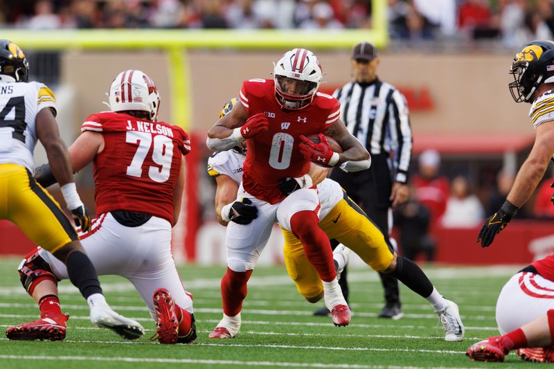 Oct 14, 2023; Madison, Wisconsin, USA;  Wisconsin Badgers running back Braelon Allen (0) rushes with the football during the third quarter against the Iowa Hawkeyes at Camp Randall Stadium. Mandatory Credit: Jeff Hanisch-USA TODAY Sports