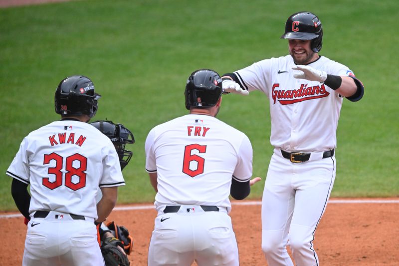 Oct 12, 2024; Cleveland, Ohio, USA; Cleveland Guardians outfielder Lane Thomas (8) celebrates hitting a gran slam with outfielder Steven Kwan (38) and first base David Fry (6) in the fifth inning against the Detroit Tigers during game five of the ALDS for the 2024 MLB Playoffs at Progressive Field. Mandatory Credit: David Richard-Imagn Images