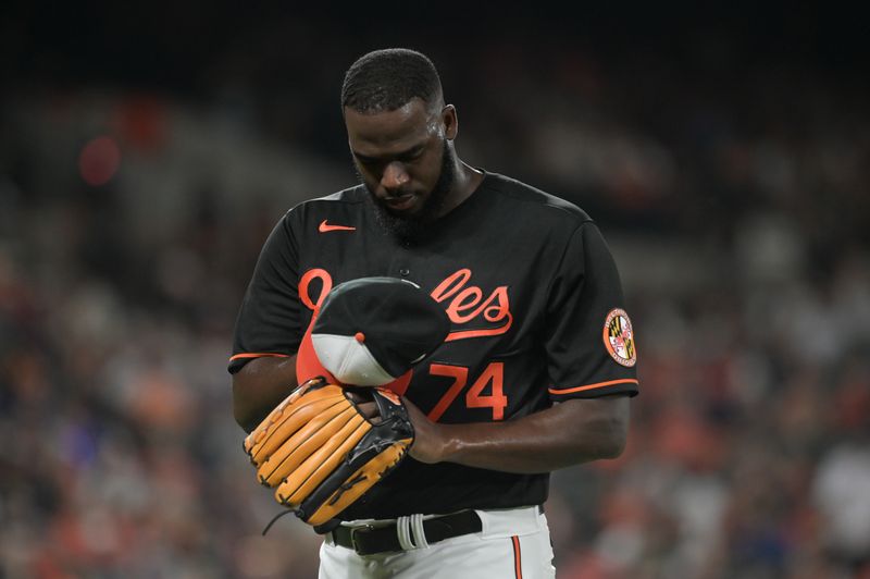 Aug 8, 2023; Baltimore, Maryland, USA;  Baltimore Orioles relief pitcher Felix Bautista (74) looks towards his hat after being relieved during the ninth inning against the Houston Astros at Oriole Park at Camden Yards. Mandatory Credit: Tommy Gilligan-USA TODAY Sports