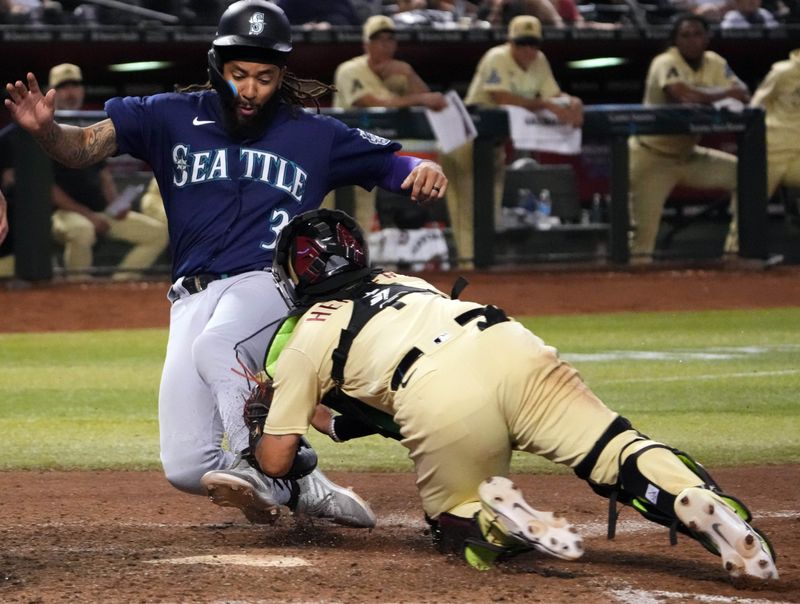 Jul 28, 2023; Phoenix, Arizona, USA; Arizona Diamondbacks catcher Jose Herrera (11) tags out Seattle Mariners shortstop J.P. Crawford (3) during the ninth inning at Chase Field. Mandatory Credit: Joe Camporeale-USA TODAY Sports