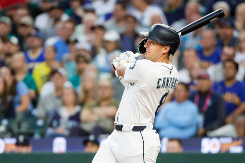Sep 10, 2025; Seattle, Washington, USA; Seattle Mariners right fielder Dominic Canzone (8) hits an RBI-sacrifice fly against the St. Louis Cardinals during the second inning at T-Mobile Park. Mandatory Credit: Joe Nicholson-Imagn Images