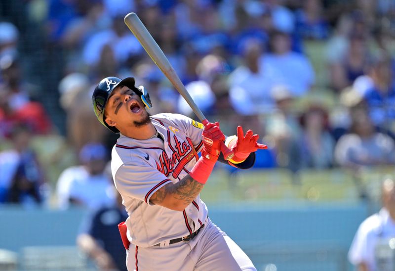 Sep 3, 2023; Los Angeles, California, USA; Atlanta Braves shortstop Orlando Arcia (11) reacts after a pop out in the eighth inning against the Los Angeles Dodgers at Dodger Stadium. Mandatory Credit: Jayne Kamin-Oncea-USA TODAY Sports