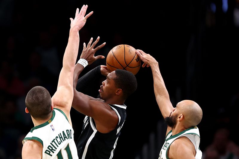 BOSTON, MASSACHUSETTS - NOVEMBER 10: Derrick White #9 of the Boston Celtics blocks a shot from Lonnie Walker IV #8 of the Brooklyn Nets during the second quarter of their In-Season Tournament game at TD Garden on November 10, 2023 in Boston, Massachusetts. NOTE TO USER: User expressly acknowledges and agrees that, by downloading and or using this photograph, User is consenting to the terms and conditions of the Getty Images License Agreement. (Photo by Maddie Meyer/Getty Images)