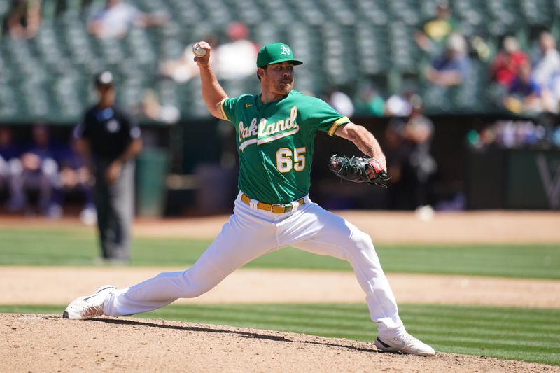 Aug 9, 2023; Oakland, California, USA; Oakland Athletics pitcher Trevor May (65) throws against the Texas Rangers in the ninth inning at Oakland-Alameda County Coliseum. Mandatory Credit: Cary Edmondson-USA TODAY Sports