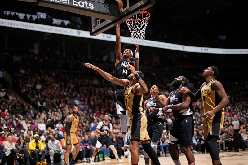 TORONTO, CANADA - JANUARY 26: Terance Mann #14 of the LA Clippers drives to the basket during the game against the Toronto Raptors on January 26, 2024 at the Scotiabank Arena in Toronto, Ontario, Canada.  NOTE TO USER: User expressly acknowledges and agrees that, by downloading and or using this Photograph, user is consenting to the terms and conditions of the Getty Images License Agreement.  Mandatory Copyright Notice: Copyright 2024 NBAE (Photo by Mark Blinch/NBAE via Getty Images)