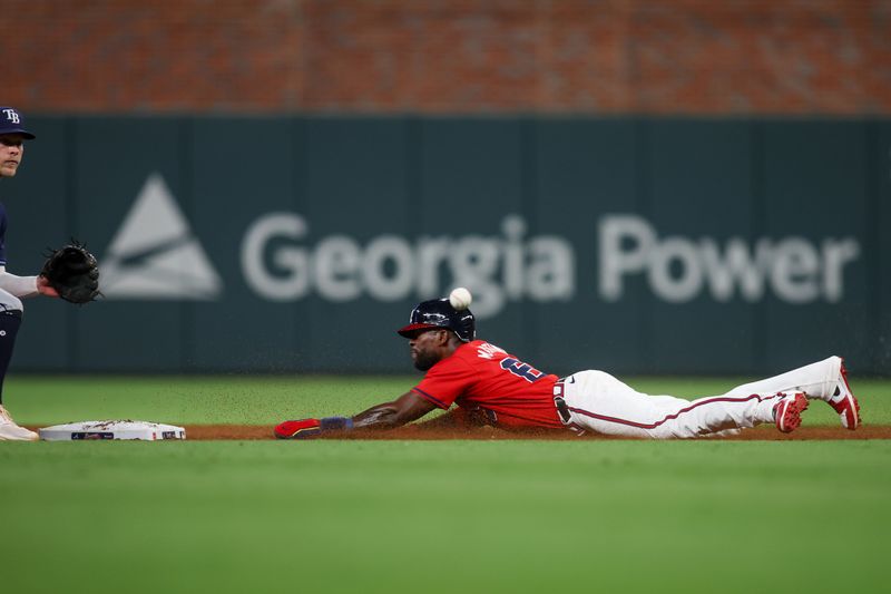 Jun 14, 2024; Atlanta, Georgia, USA; Atlanta Braves center fielder J.P. Martinez (63) steals second against the Tampa Bay Rays in the eighth inning at Truist Park. Mandatory Credit: Brett Davis-USA TODAY Sports
