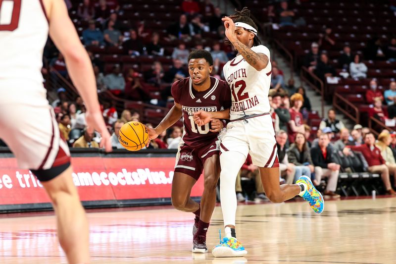 Jan 31, 2023; Columbia, South Carolina, USA; Mississippi State Bulldogs guard Dashawn Davis (10) is fouled by South Carolina Gamecocks guard Zachary Davis (12) in the second half at Colonial Life Arena. Mandatory Credit: Jeff Blake-USA TODAY Sports