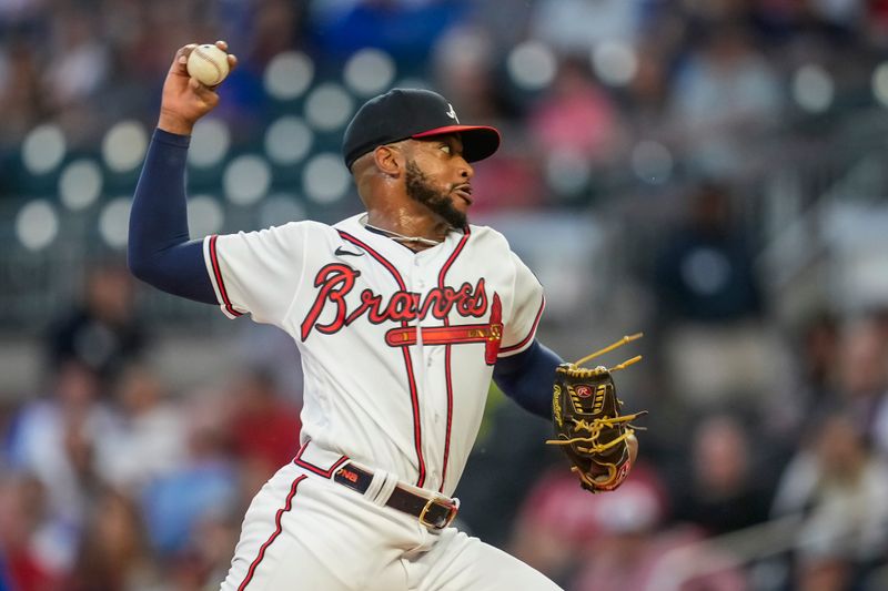 Sep 27, 2023; Cumberland, Georgia, USA; Atlanta Braves starting pitcher Darius Vines (64) pitches against the Chicago Cubs during the first inning at Truist Park. Mandatory Credit: Dale Zanine-USA TODAY Sports